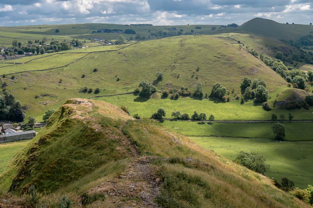 View the other side of the hill with views of other hills in the Peaks