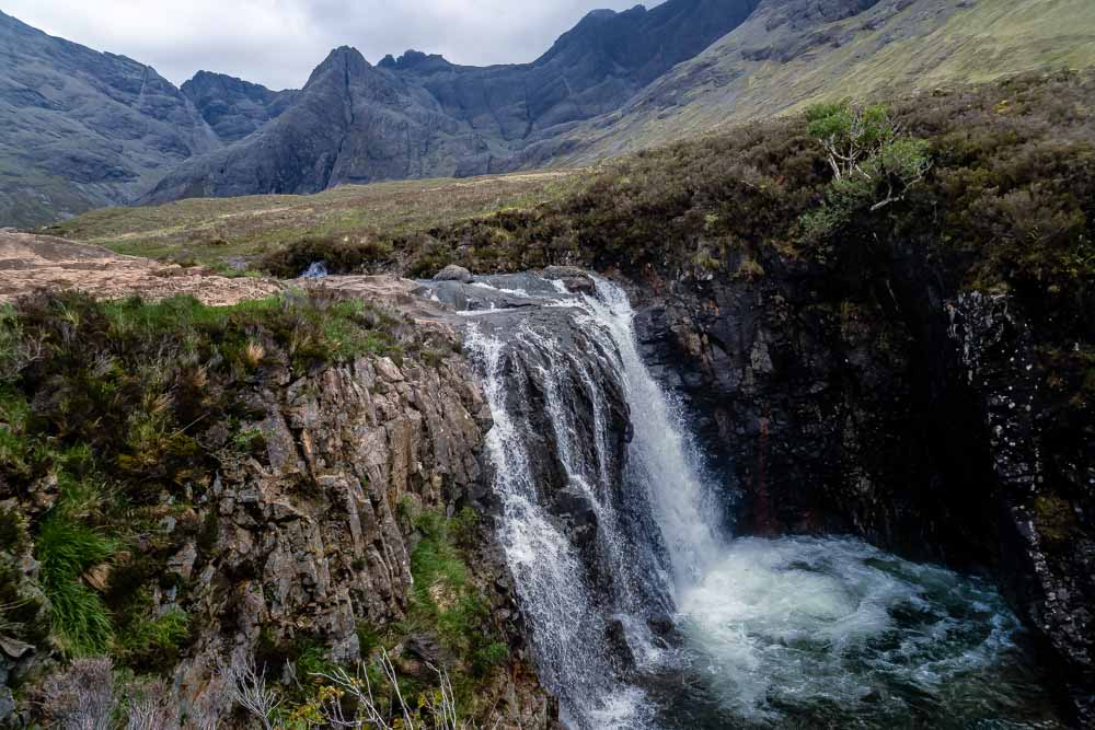 One of the few waterfalls at Fairy Pools with the mighty Cuillin mountains in the background